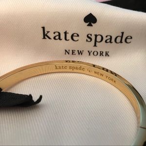 Kate Spade fuchsia bangle bracelet with clasp.